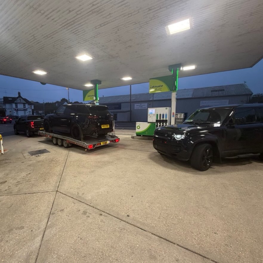 Range Rover and Defender during an evening transport journey